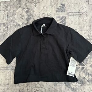 lululemon athletica Black Women's Polo Top size 2 (small)